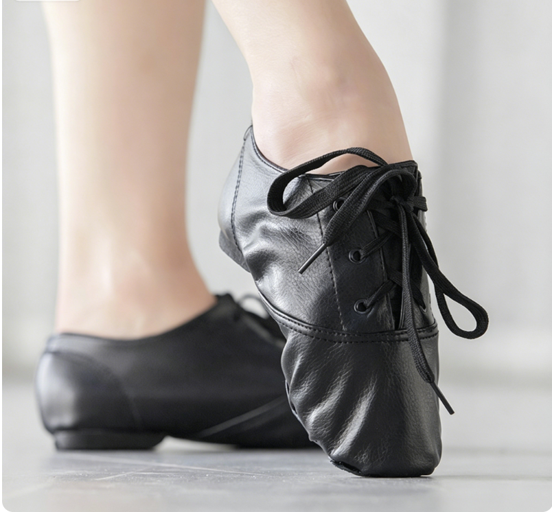 Black PU leather lace-up jazz dance shoes worn on foot