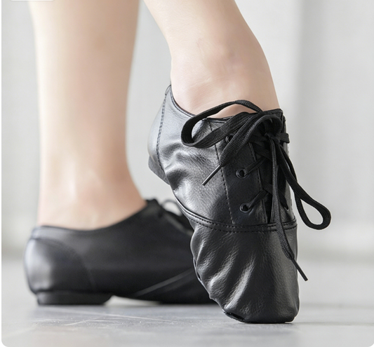 Black PU leather lace-up jazz dance shoes worn on foot