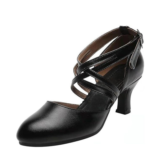 Black closed toe women's latin dance shoes with crisscross ankle strap and medium low heel