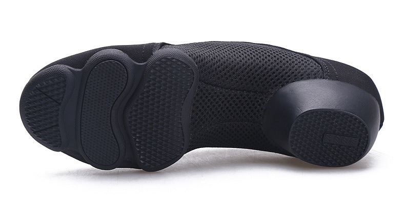 Black dance shoes with flexible split sole, ideal for spins and footwork