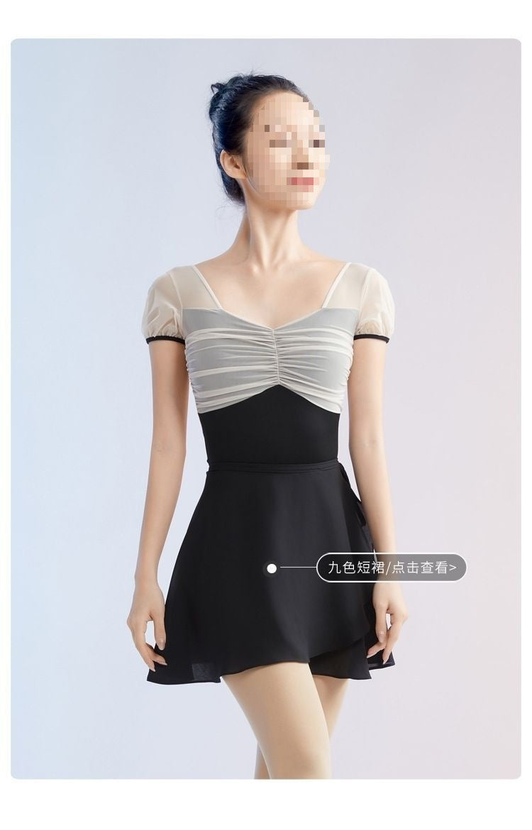 Close-up of ruched front on women's mesh ballet leotard, puff sleeve dance wear