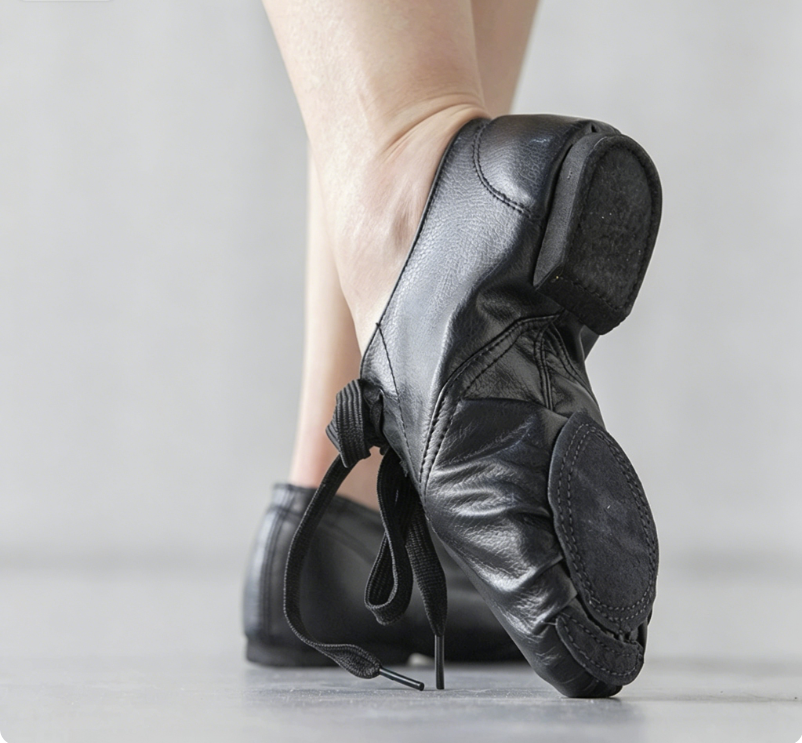 Black low-heel jazz shoes showing flexible split sole