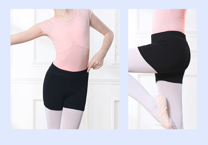 High-waisted black ballet shorts (8cm rise) for kids, side view with tummy control