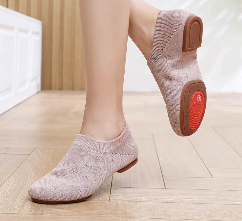 Tan knit jazz shoes showing both indoor and outdoor soles