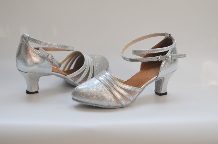 Silver glittery women's tango dance shoes with closed toe, mesh upper, mid heel and suede sole for indoor dance floors