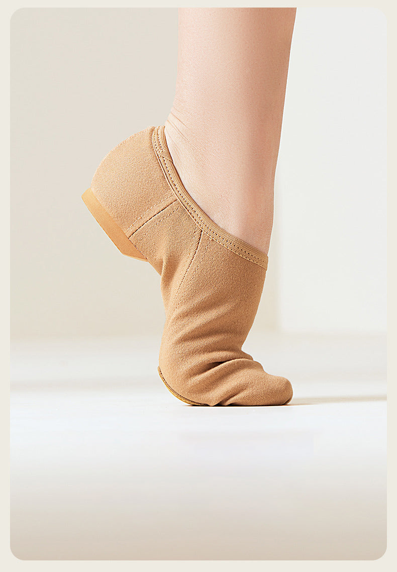 Close-up of no-tie canvas jazz shoes worn on foot, comfortable fit