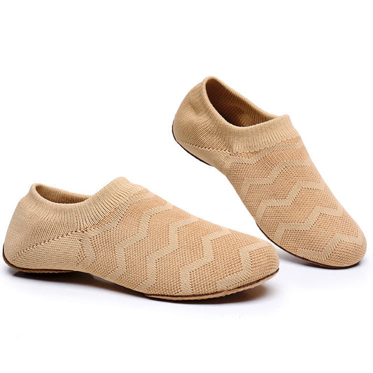 Nude knit slip-on jazz dance shoes worn on foot