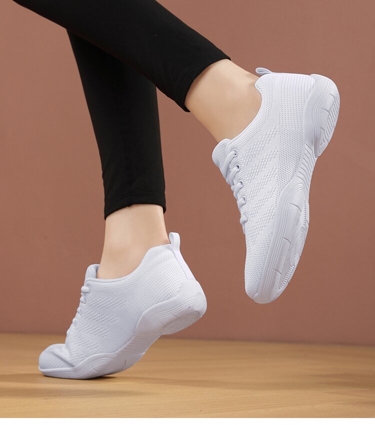 Non-slip rubber sole texture on white cheerleading sneakers