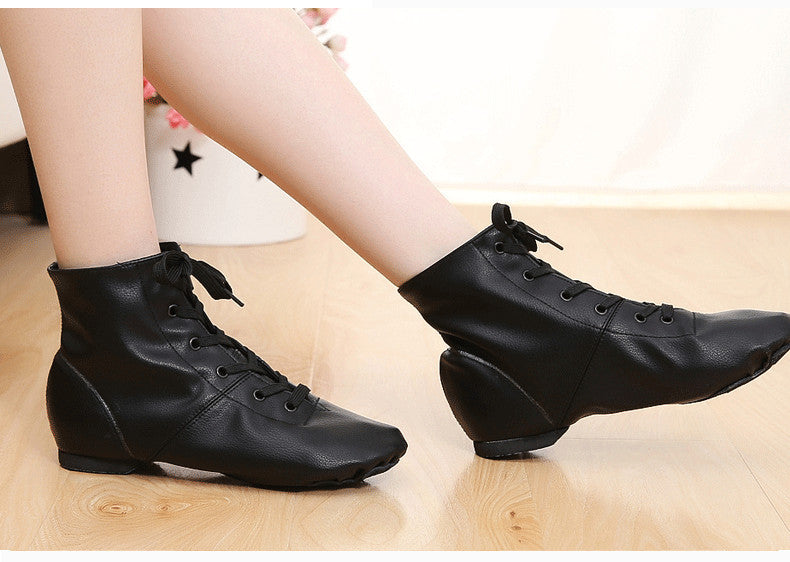 Pair of black jazz dance boots on a clean studio background
