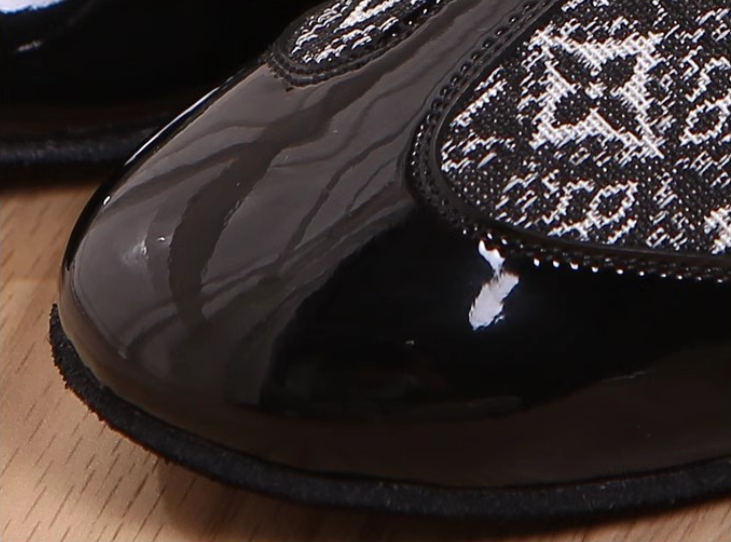 Stylish men's dance shoes with patent leather toe and patterned fabric upper